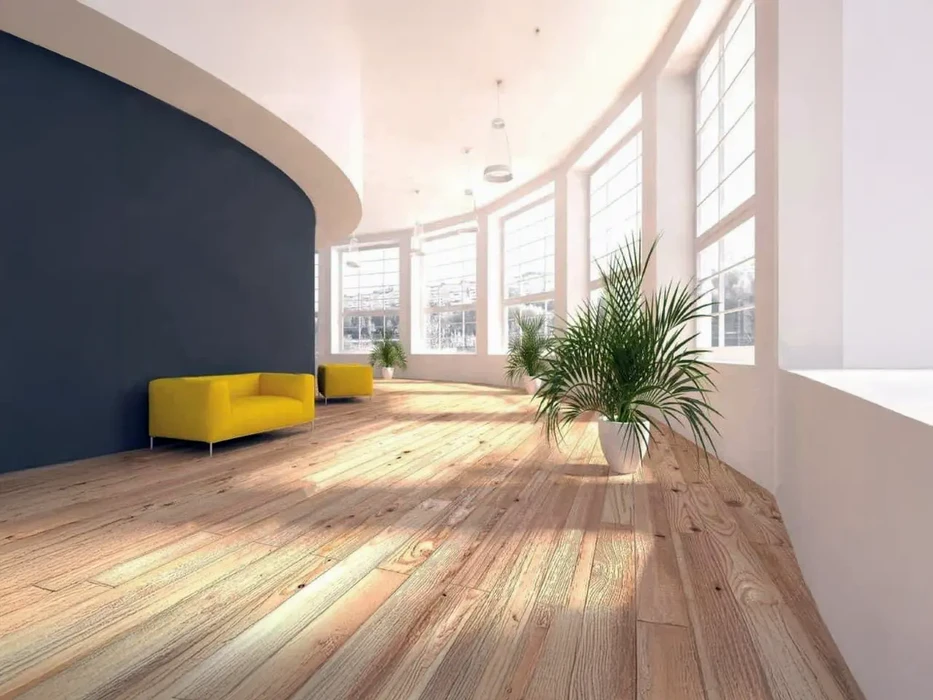 Couloir d'appartement moderne avec parquet en chêne massif, murs blancs et porte grise anthracite